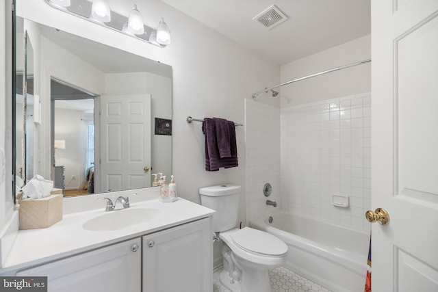 full bathroom featuring vanity, visible vents, shower / bath combination, tile patterned floors, and toilet