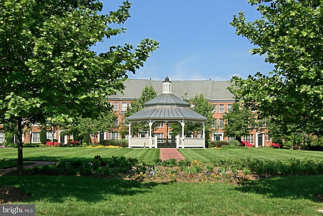 view of property's community with a gazebo and a yard