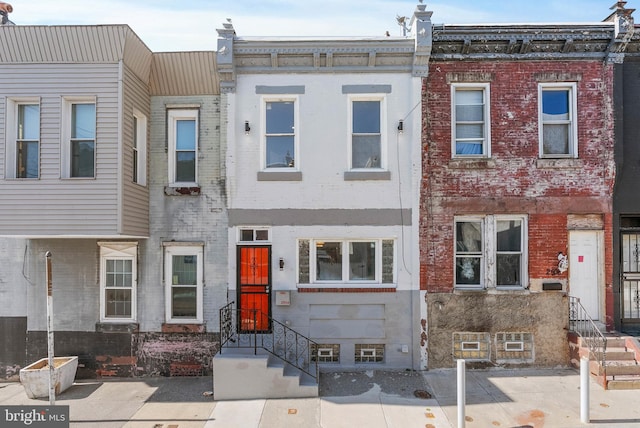 view of property with brick siding