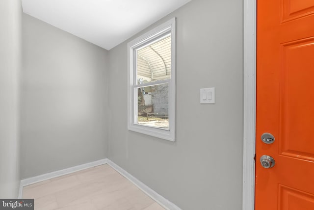 interior space featuring baseboards