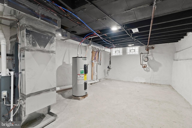 basement with heating unit and electric water heater