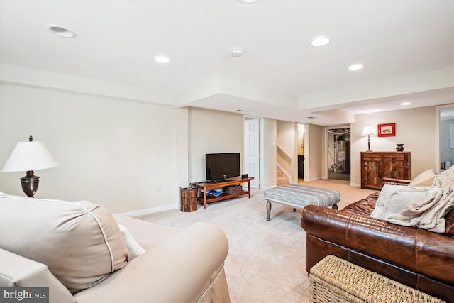 living room featuring stairway, recessed lighting, baseboards, and light carpet