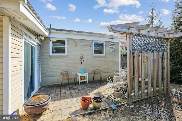 view of patio / terrace featuring fence