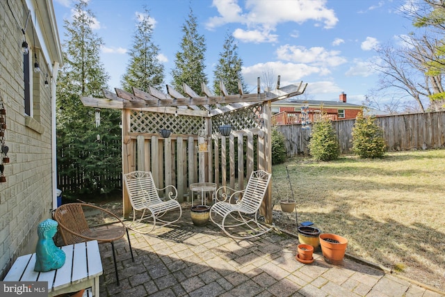 view of patio / terrace featuring fence and a pergola