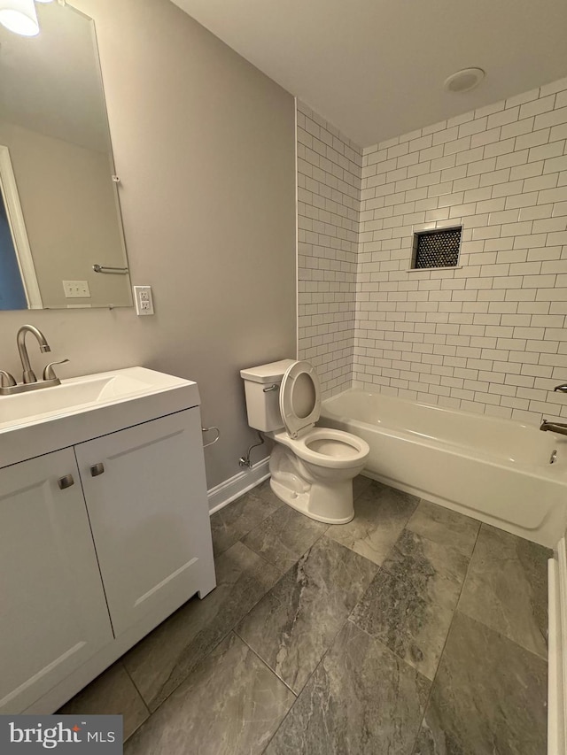 full bathroom featuring vanity, toilet, washtub / shower combination, and baseboards