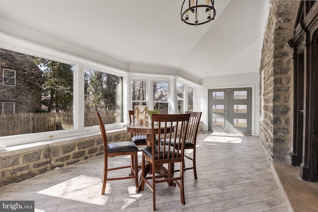 sunroom / solarium with vaulted ceiling