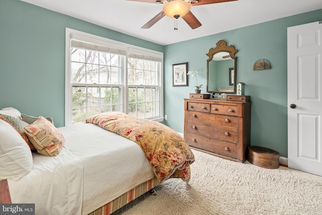 bedroom with ceiling fan and carpet