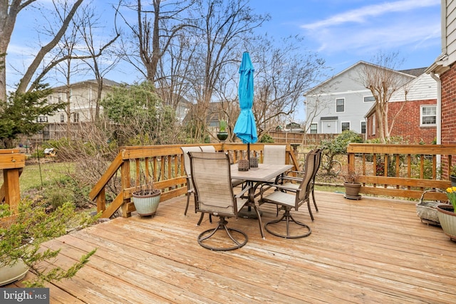 wooden deck featuring outdoor dining area and fence