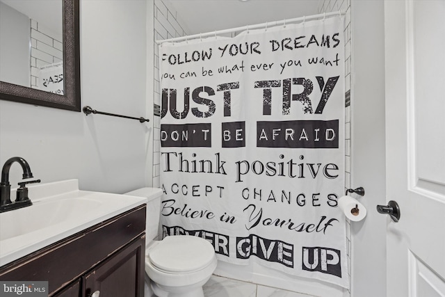 bathroom featuring a shower with curtain, toilet, vanity, and marble finish floor