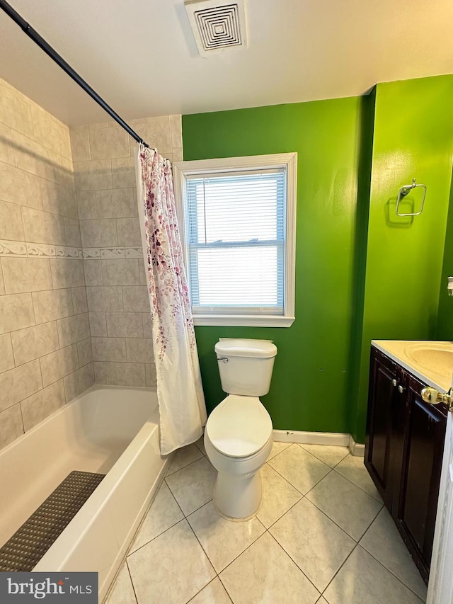 bathroom with tile patterned floors, visible vents, toilet, shower / tub combo, and vanity