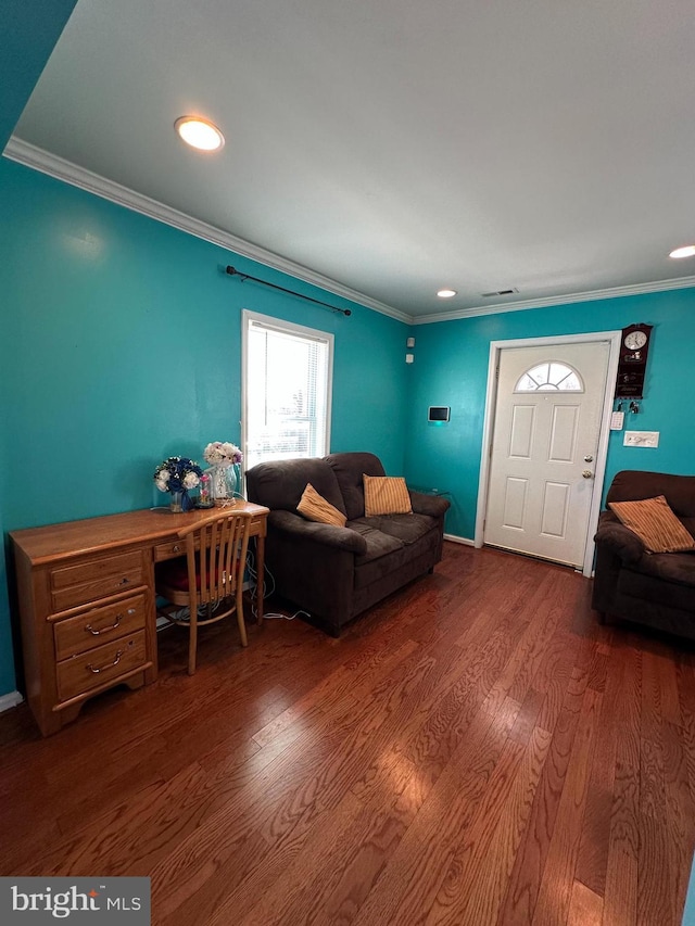 living area with recessed lighting, wood finished floors, and crown molding