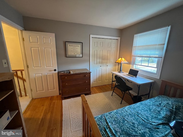 bedroom with a closet and light wood-style flooring