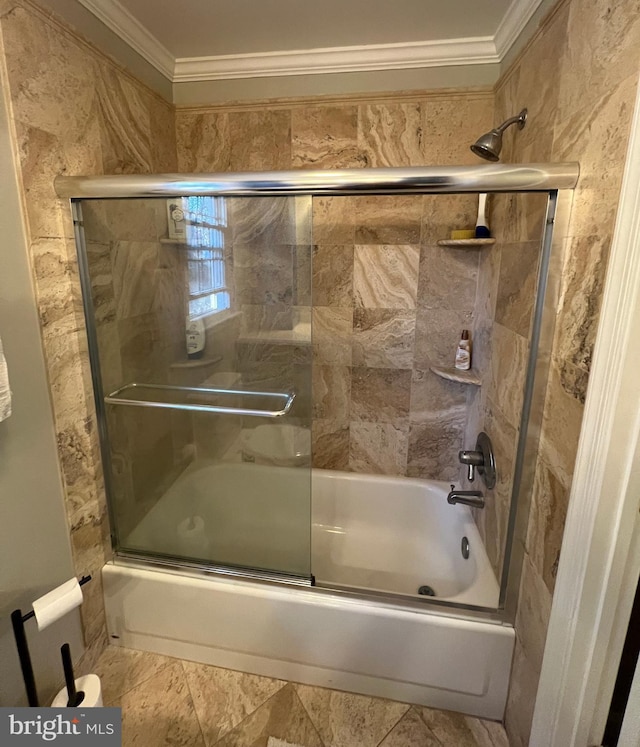 bathroom featuring combined bath / shower with glass door and ornamental molding