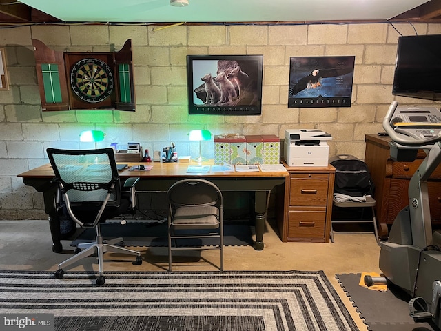 office space featuring concrete floors and concrete block wall