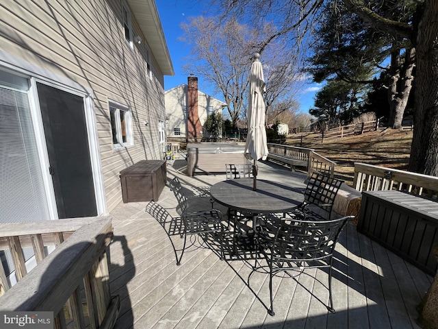 wooden deck with outdoor dining space