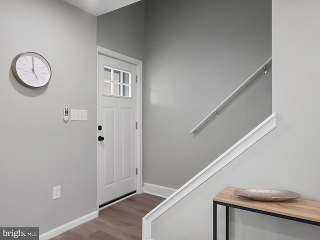 entryway featuring wood finished floors and baseboards