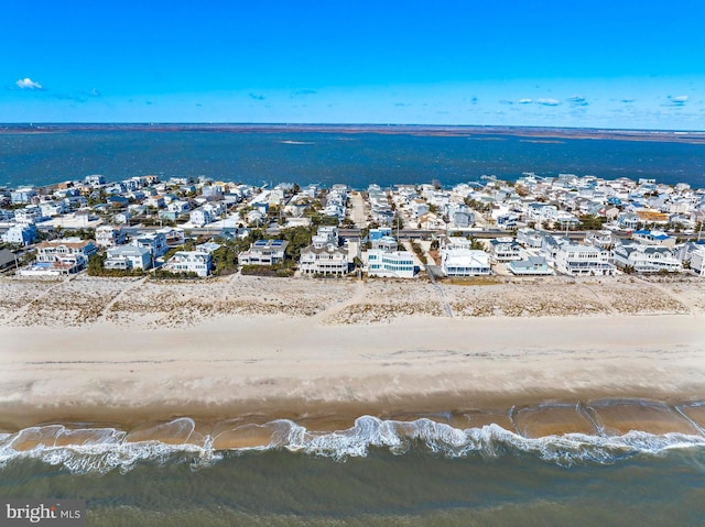 drone / aerial view with a residential view and a water view