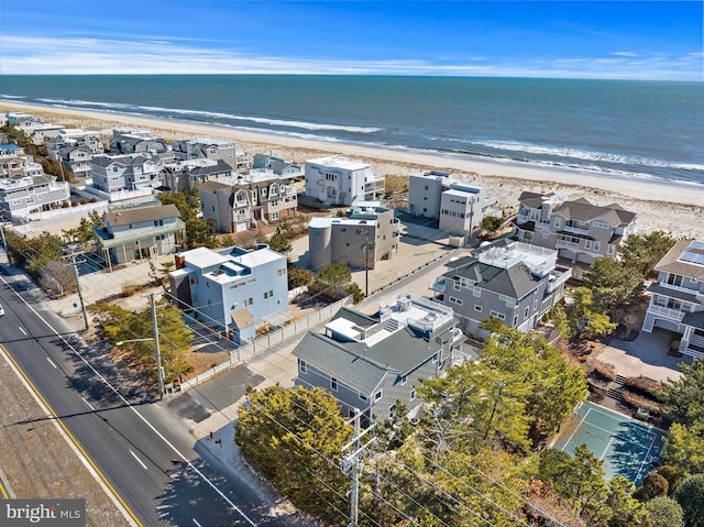 bird's eye view featuring a beach view and a water view