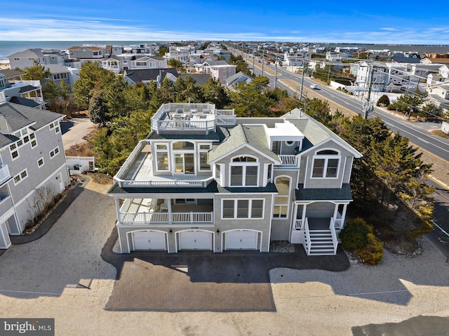 birds eye view of property with a residential view