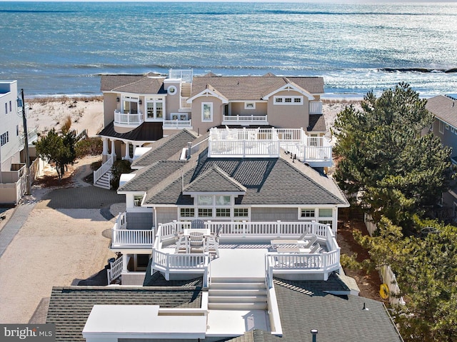 bird's eye view with a water view and a view of the beach