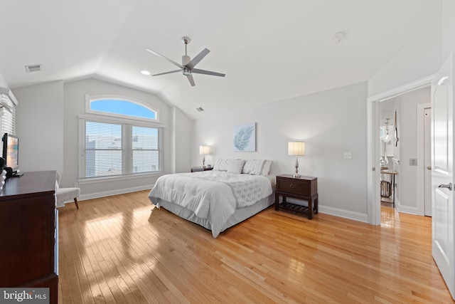 bedroom featuring vaulted ceiling, light wood-style flooring, a ceiling fan, and visible vents