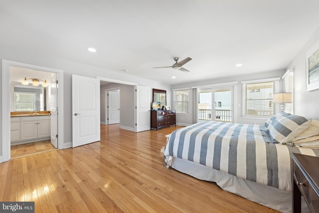 bedroom with access to exterior, recessed lighting, light wood-type flooring, and baseboards