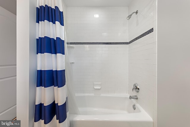 bathroom featuring shower / bath combo with shower curtain