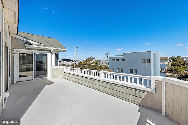 view of patio featuring a balcony