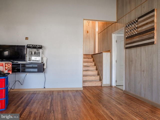 kitchen featuring wood finished floors and wood walls