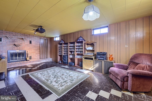 interior space with tile patterned floors, a fireplace, and wood walls