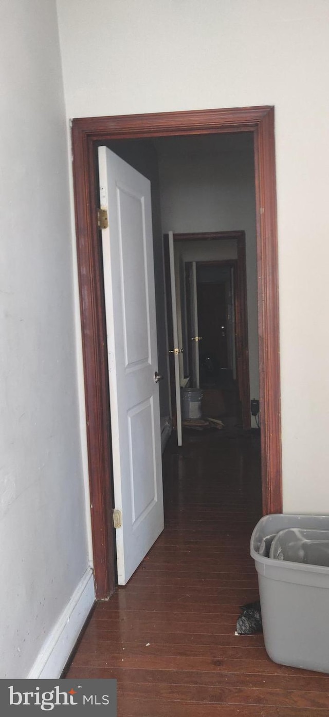 hallway with wood finished floors