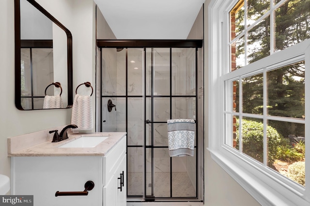 bathroom with vanity and a shower stall