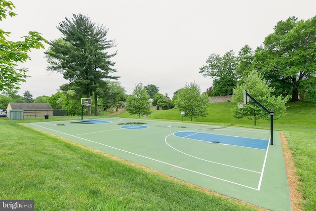 view of basketball court with a yard and community basketball court