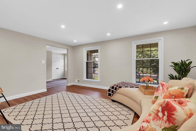 living room with dark wood-type flooring, recessed lighting, baseboards, and visible vents