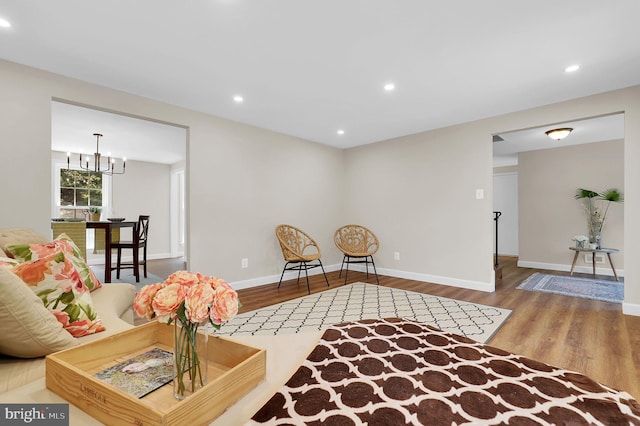 living room with recessed lighting, wood finished floors, and baseboards