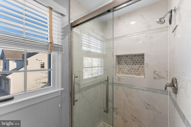 full bathroom featuring a marble finish shower