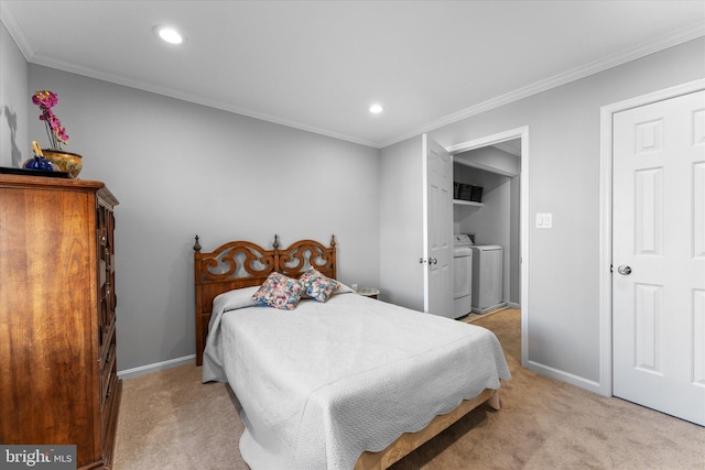 bedroom with light carpet, crown molding, washer and clothes dryer, and baseboards