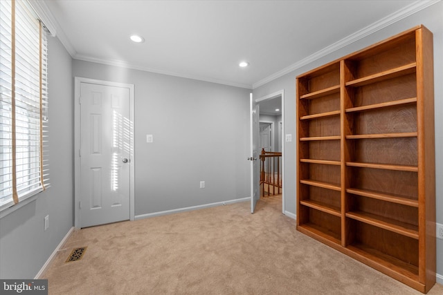 interior space featuring recessed lighting, visible vents, baseboards, and crown molding