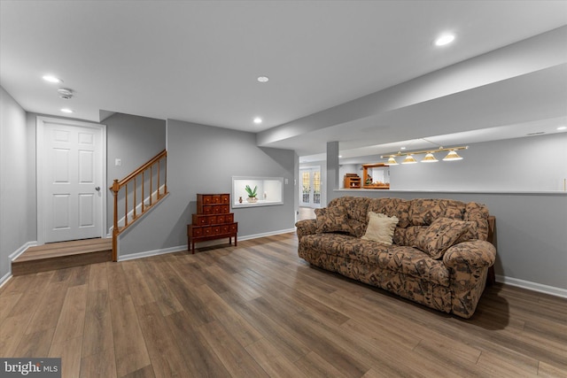 living room with stairway, recessed lighting, wood finished floors, and baseboards