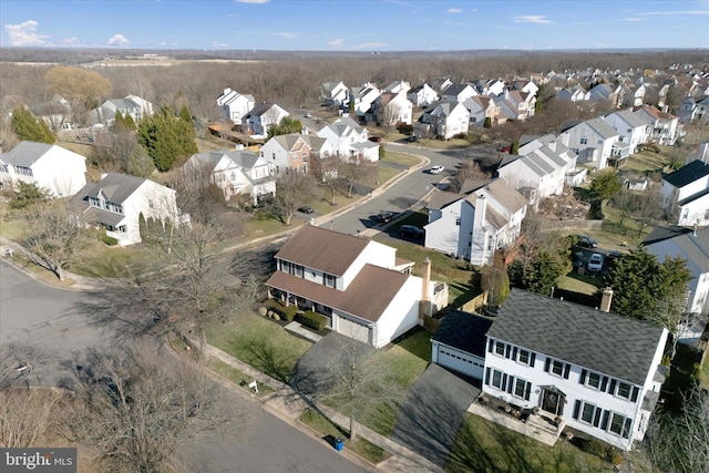 birds eye view of property with a residential view