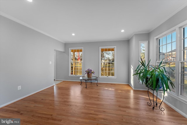 unfurnished room with recessed lighting, baseboards, wood finished floors, and crown molding