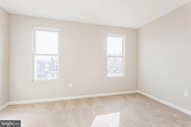 empty room with baseboards and carpet floors