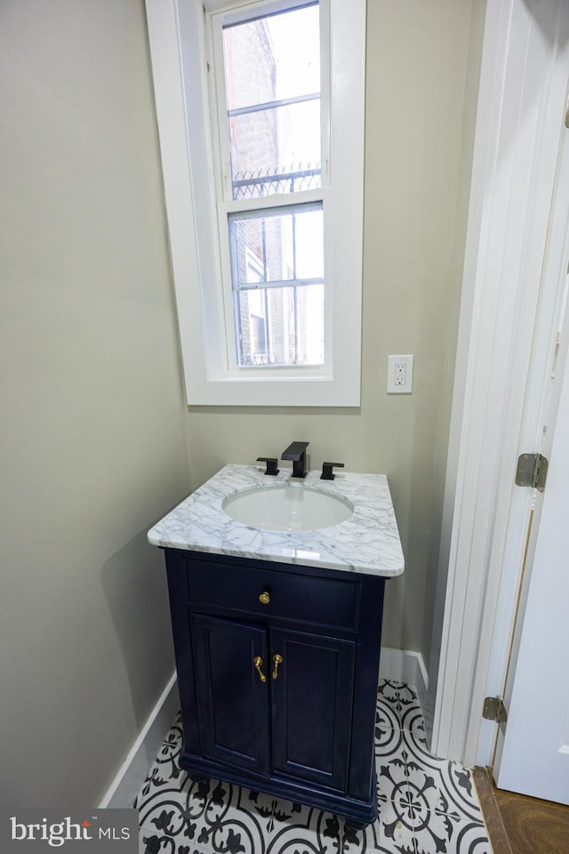 bathroom featuring vanity and baseboards