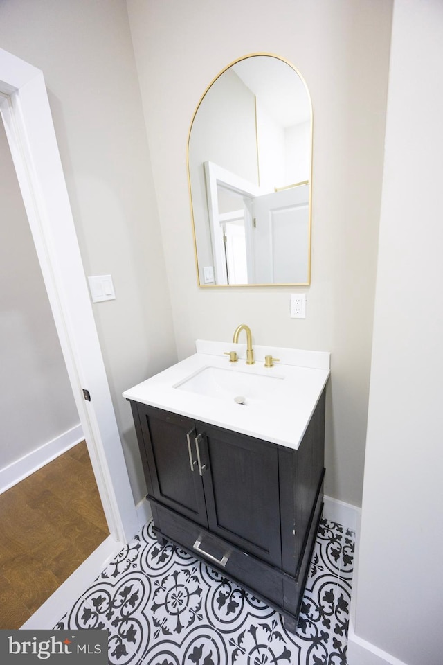 bathroom featuring baseboards and vanity