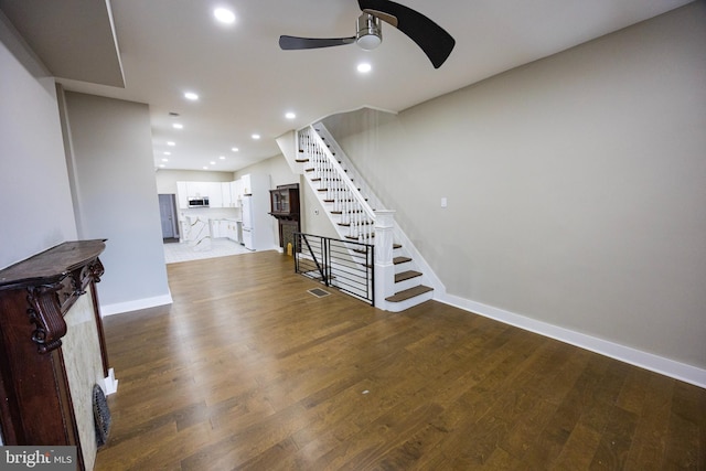 stairway with wood finished floors, visible vents, baseboards, recessed lighting, and ceiling fan