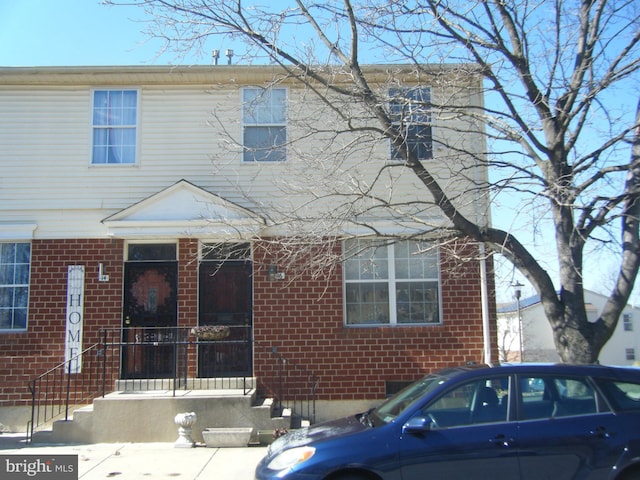 view of front of property featuring brick siding