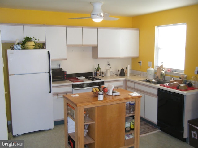 kitchen with white appliances, wooden counters, ceiling fan, a sink, and white cabinetry