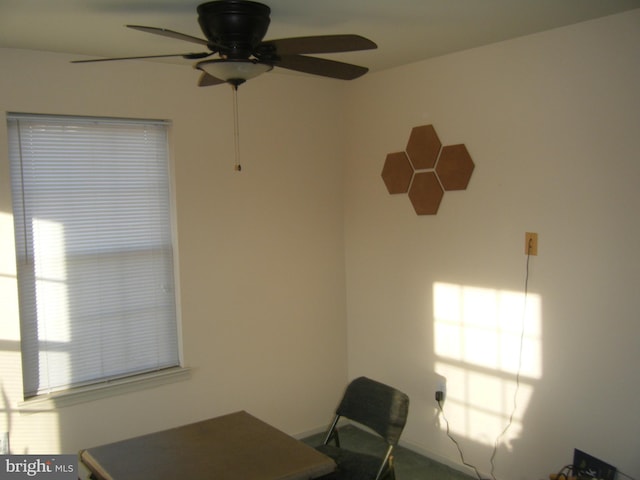 unfurnished office with ceiling fan