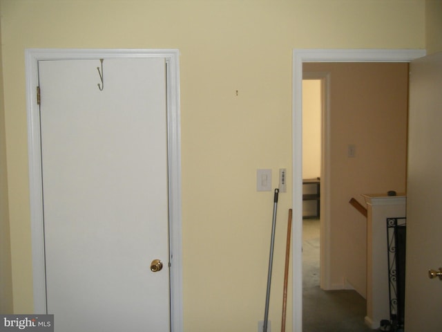 hallway featuring an upstairs landing