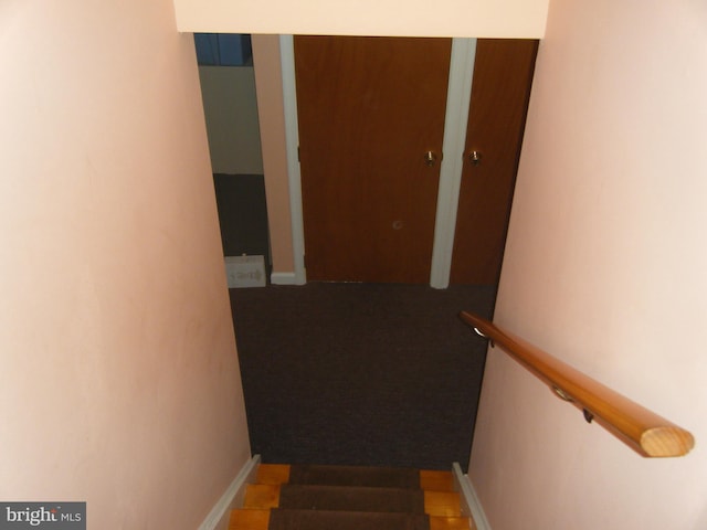 stairway with baseboards